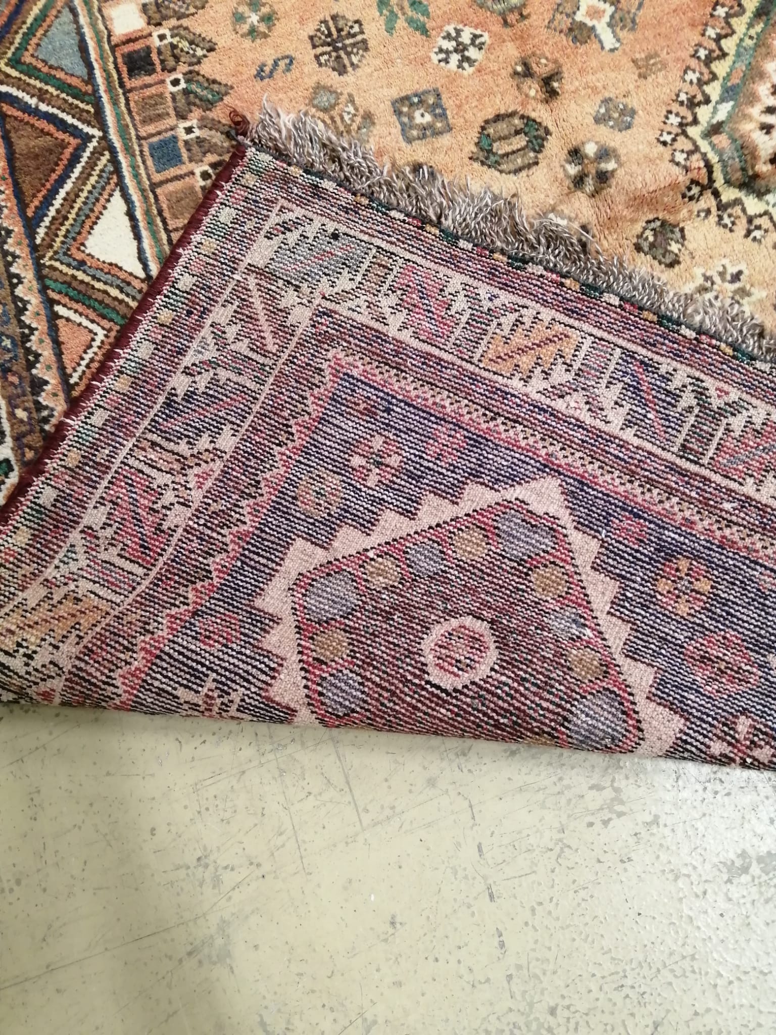 A Shiraz brick red ground carpet, 310 x 218cm